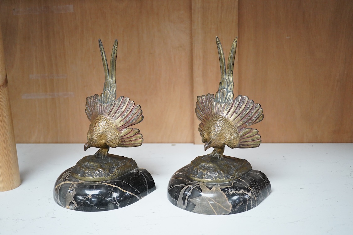 A pair of bronze peacock bookends, with remains of coloured pigments, marble plinths, signed R. Leclerc, 20cm